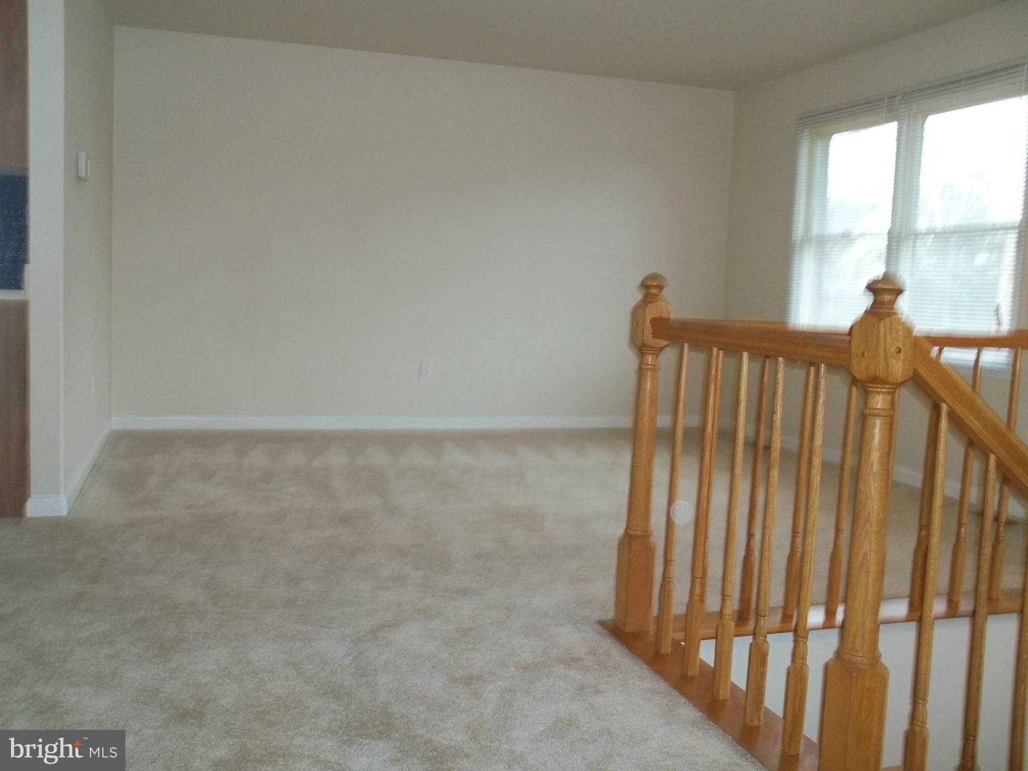 6624 Ridge Road Eldersburg, MD 21784 - Photo 7 of 20 a view of a room with stairs