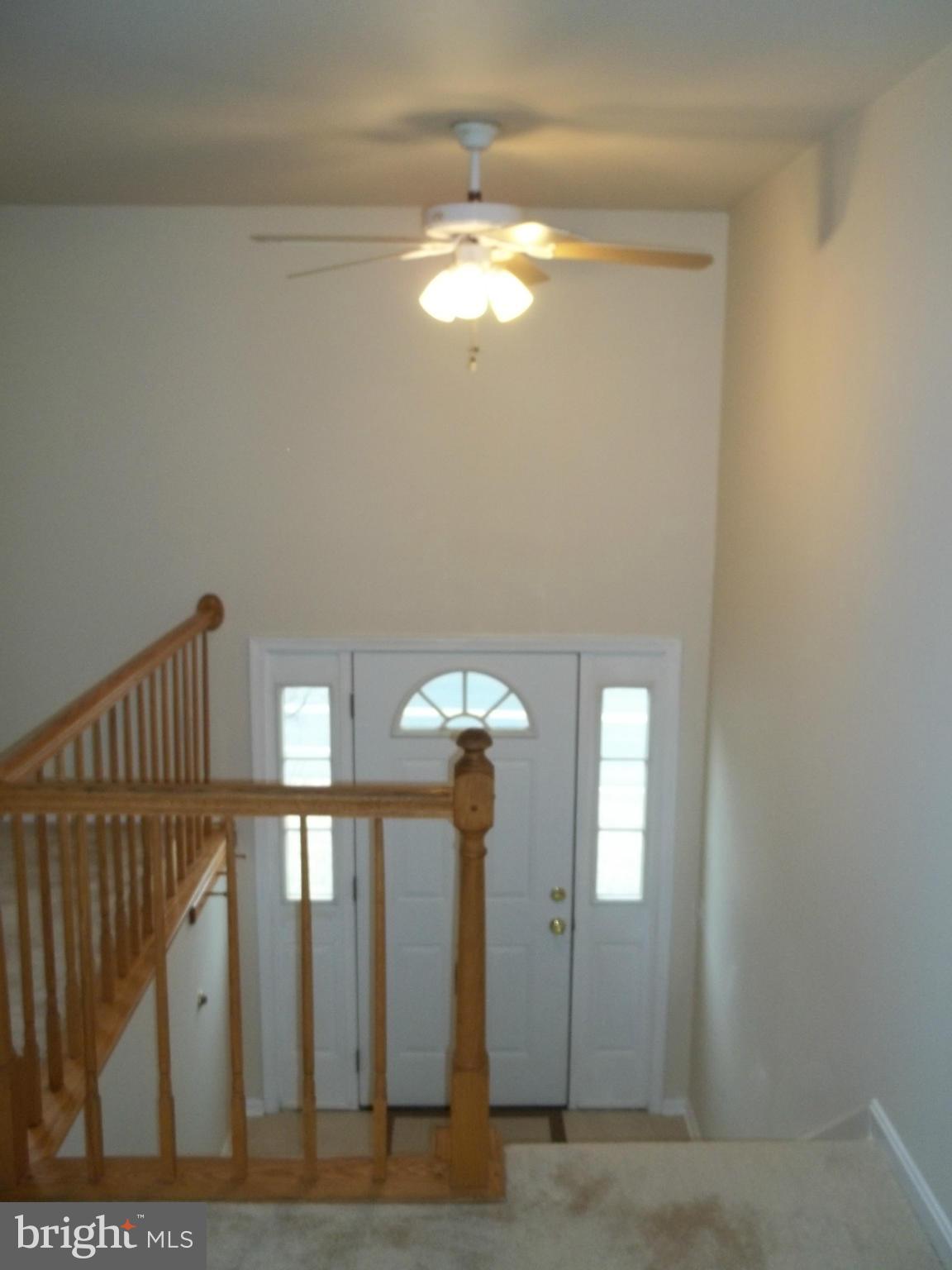 6624 Ridge Road Eldersburg, MD 21784 - Photo 8 of 20 a view of a chandelier fan and fire place