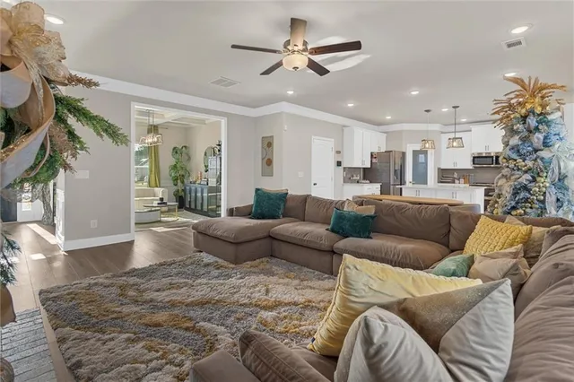 a living room with furniture and a large window