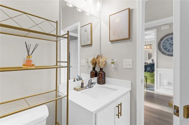 a view of a hallway with wooden floor and entryway