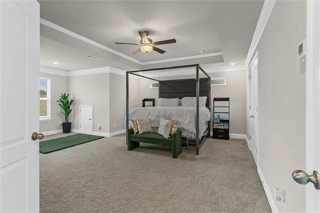 a bedroom with a bed and a ceiling fan