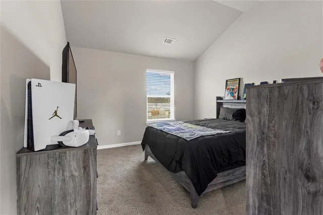 a bedroom with a bed and a closet