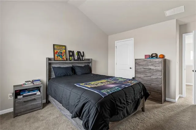 a view of room with toys and dresser