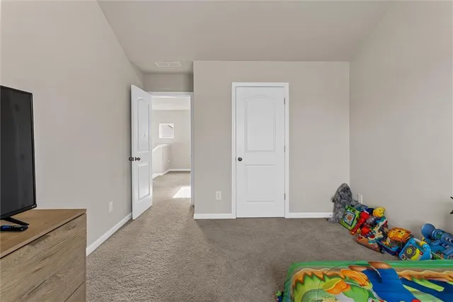 a view of a hallway with two rooms