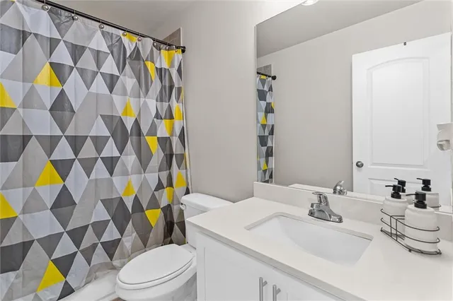 an aerial view of a residential houses with outdoor space