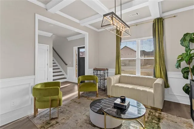 a living room with furniture and a potted plant