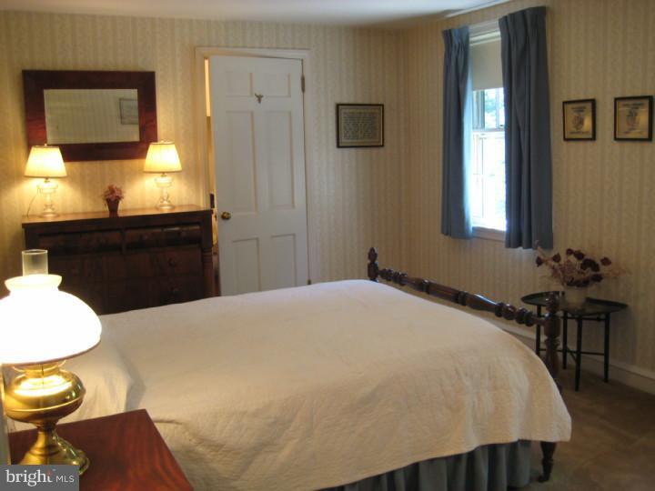110 Glenwood Road Haddonfield, NJ 08033 - Photo 12 of 17 a bedroom with a bed and a window
