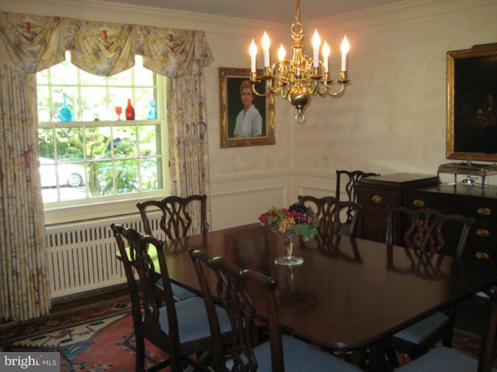 110 Glenwood Road Haddonfield, NJ 08033 - Photo 6 of 17 a view of a dining room with furniture and chandelier