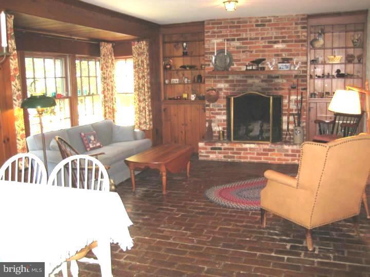 110 Glenwood Road Haddonfield, NJ 08033 - Photo 8 of 17 a living room with furniture and a fireplace