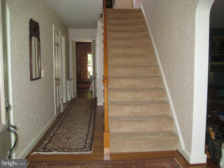 110 Glenwood Road Haddonfield, NJ 08033 - Photo 9 of 17 a view of a hallway with wooden floor and entryway