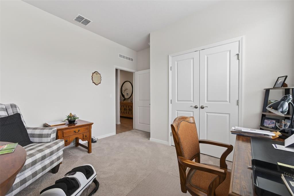 18237 Beach Ranch Terrace Bradenton, FL 34211 - Photo 23 of 72 a room with furniture and gym equipment