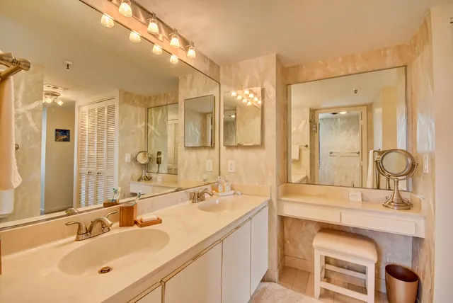 a bathroom with a double vanity sink mirror and double