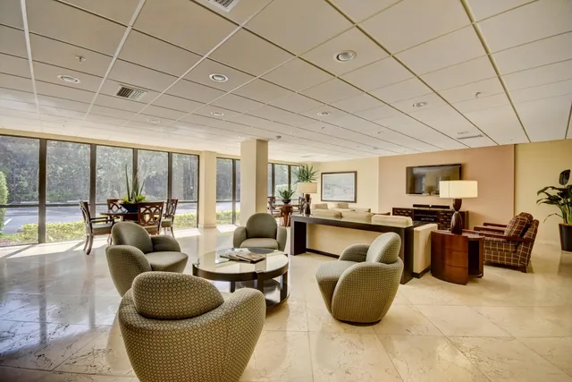 a view of a lobby with furniture and floor to ceiling window