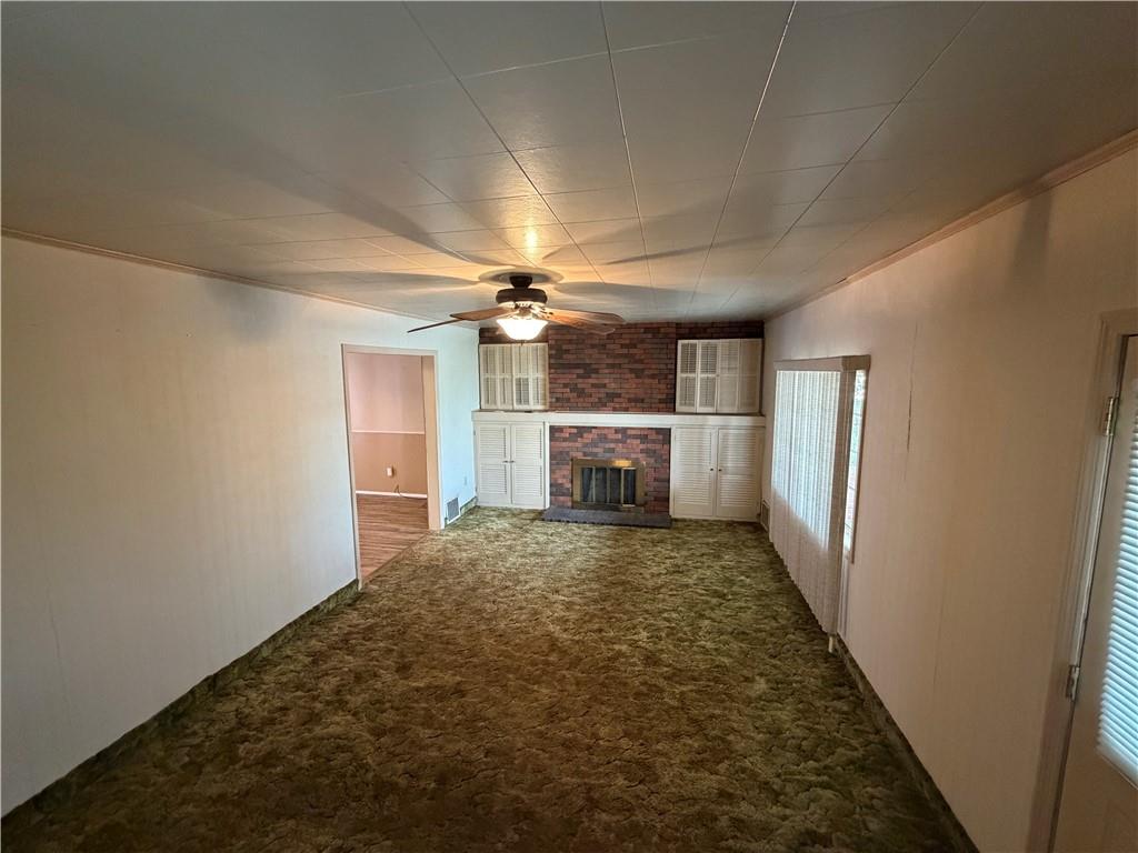 1041 4th Street Monongahela, PA 15063 - Photo 15 of 28 an empty room with windows and fireplace