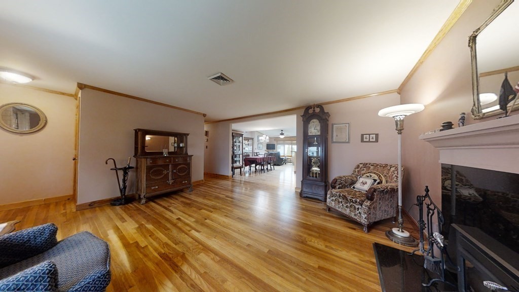 51 Miriam Road Waltham, MA 02451 - Photo 8 of 17 a living room with furniture and a fireplace