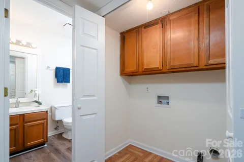 a bathroom with a sink a toilet and vanity