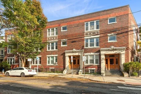 a front view of a building with street view