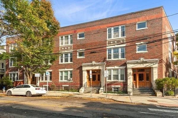 a front view of a building with street view