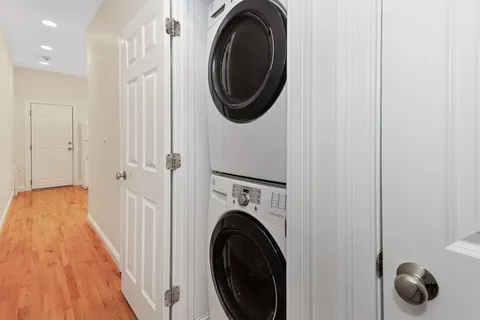 a view of a hallway with washer and dryer