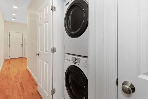 a view of a hallway with washer and dryer