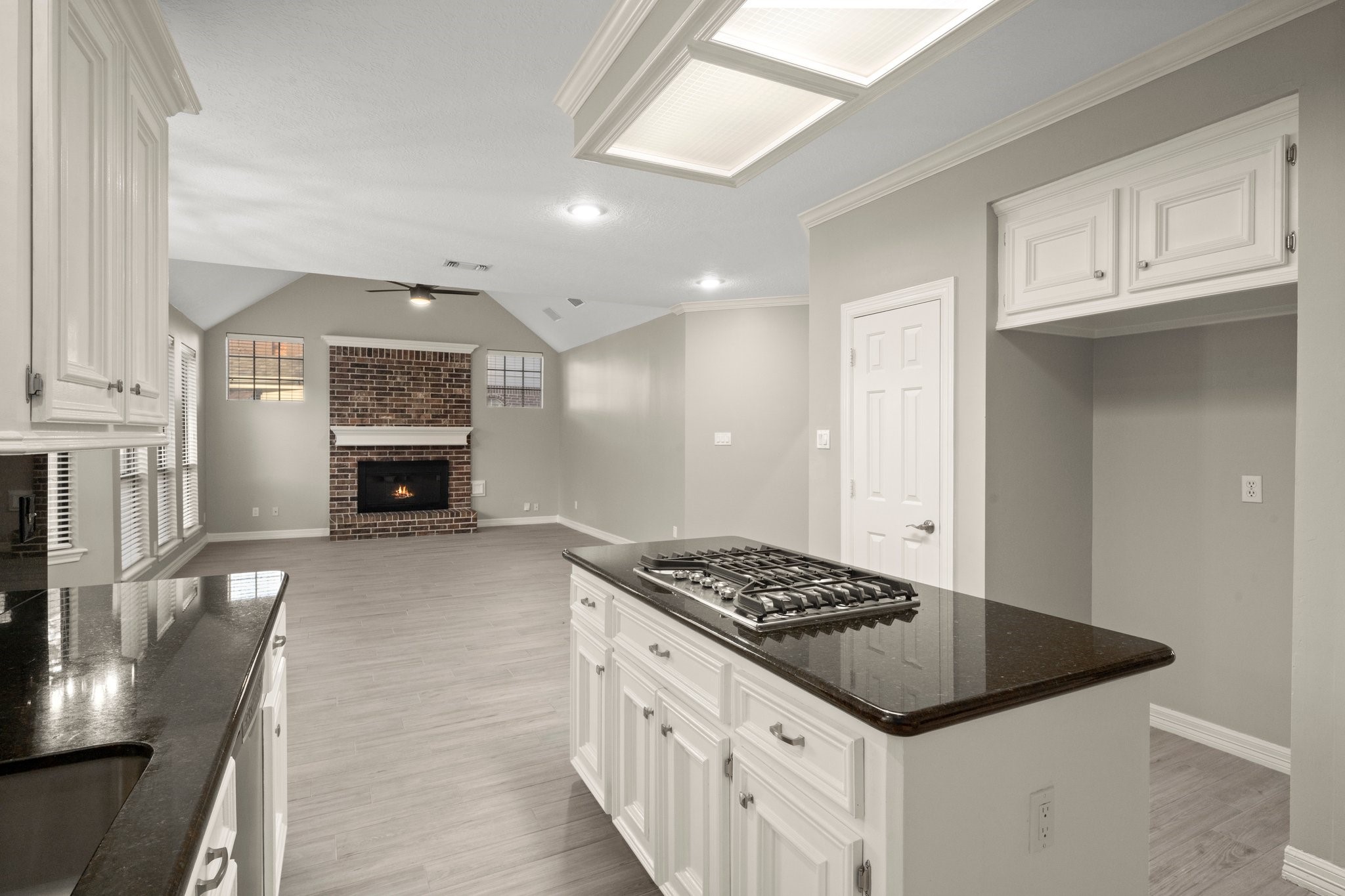 8222 Redchurch Drive Spring, TX 77379 - Photo 22 of 36 a kitchen with stainless steel appliances granite countertop a stove and a sink