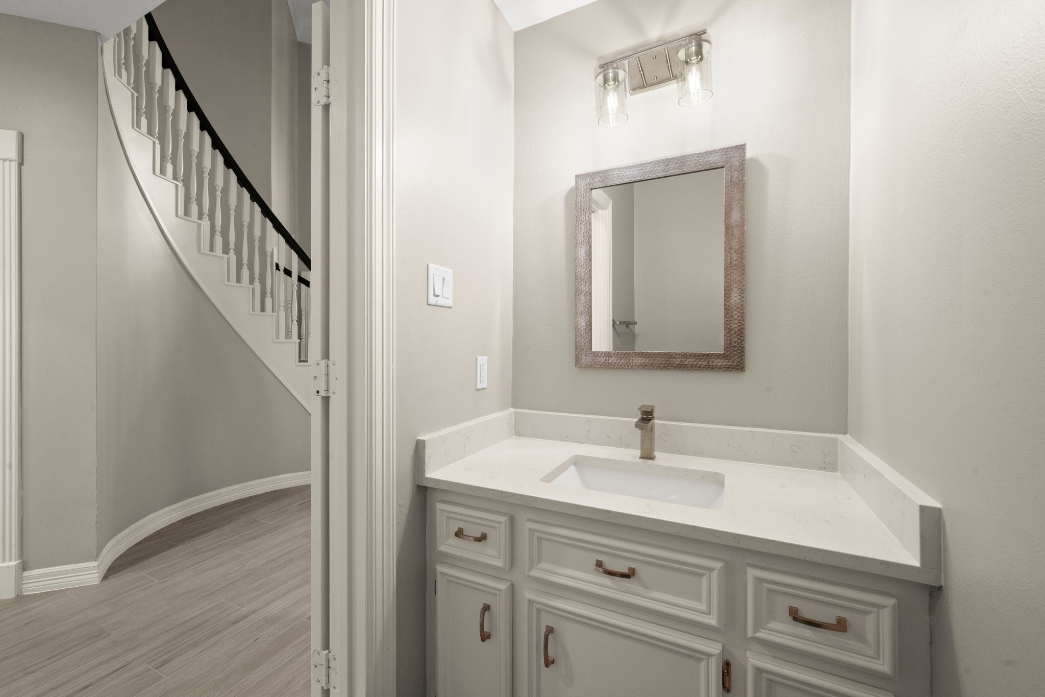 8222 Redchurch Drive Spring, TX 77379 - Photo 24 of 36 a bathroom with a sink and a mirror