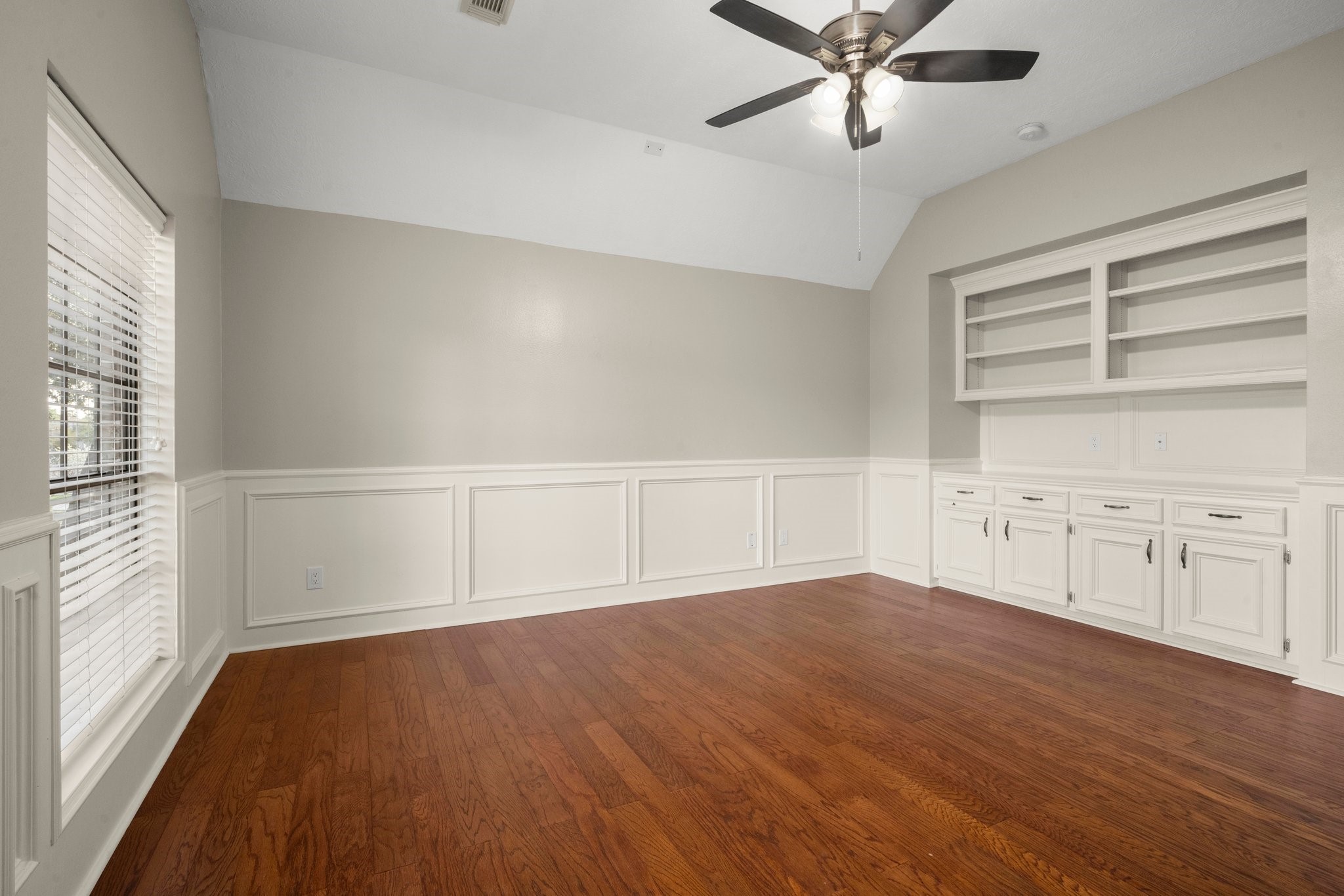 8222 Redchurch Drive Spring, TX 77379 - Photo 32 of 36 wooden floor in an empty room with a window