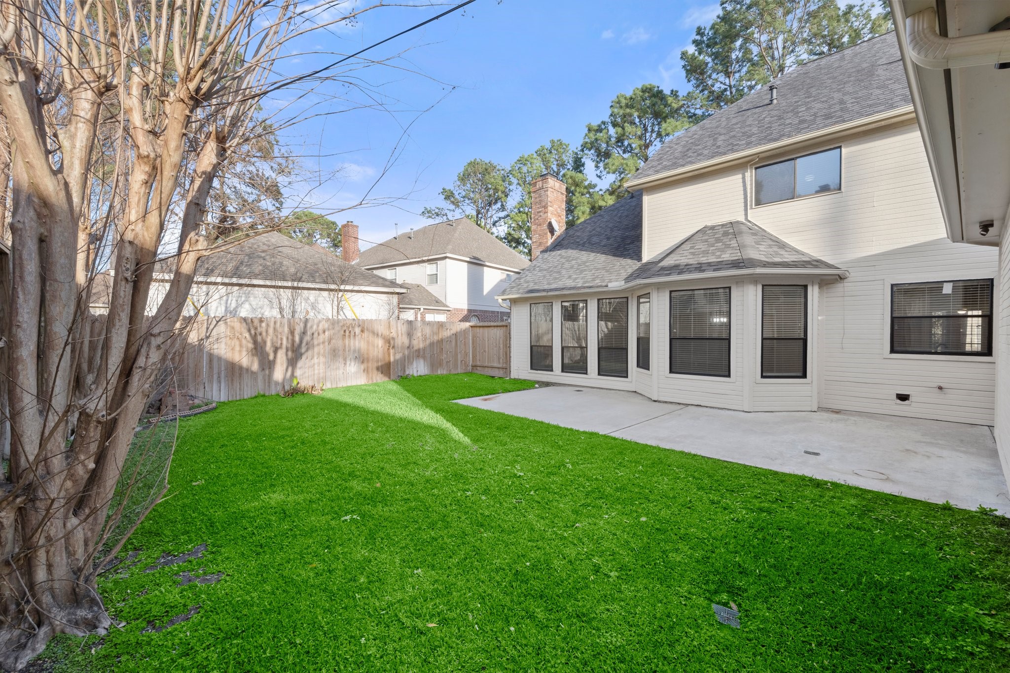 8222 Redchurch Drive Spring, TX 77379 - Photo 33 of 36 a view of a house with a yard and a garden