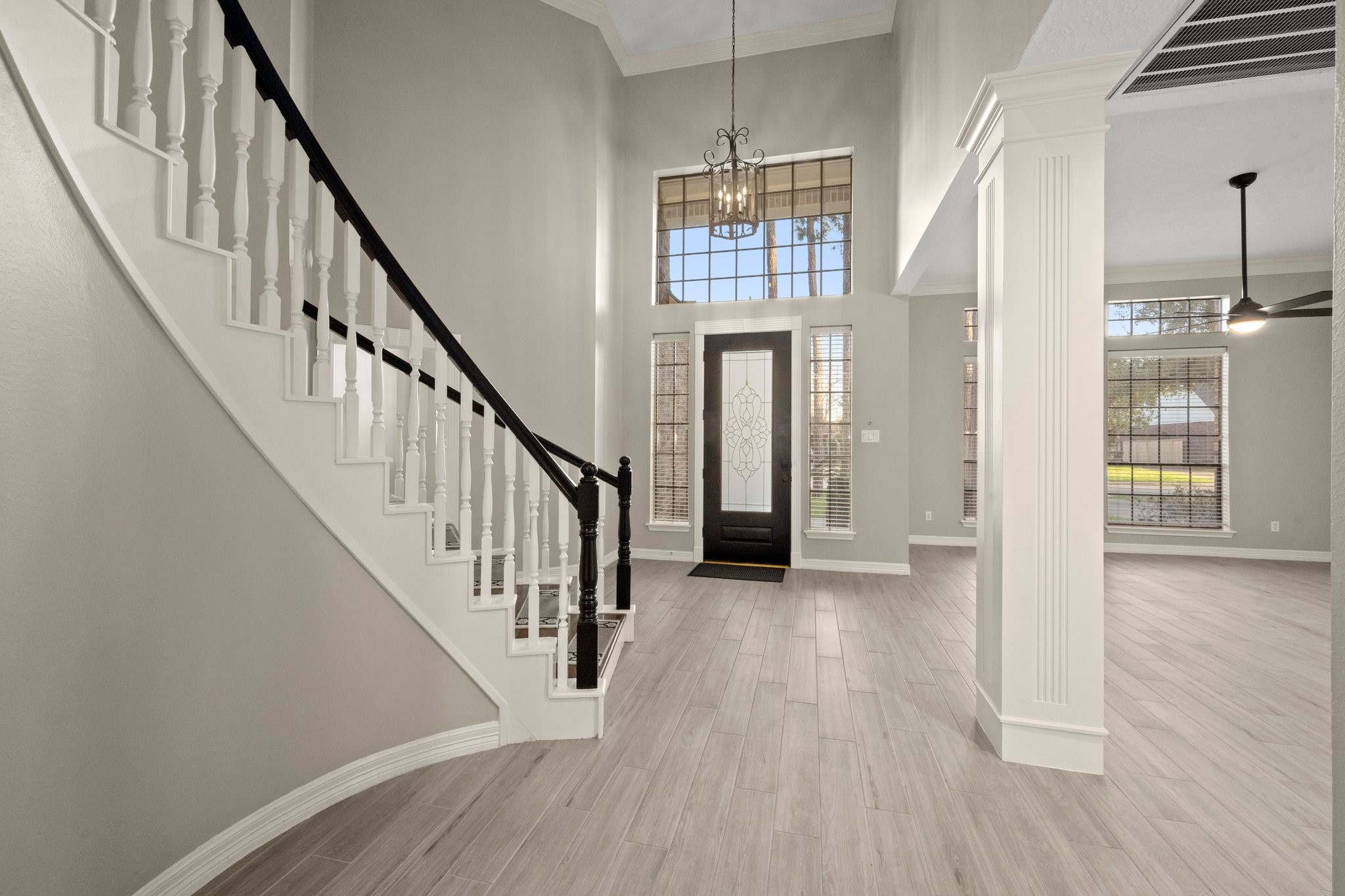 8222 Redchurch Drive Spring, TX 77379 - Photo 6 of 36 a view of staircase with wooden floor and staircase