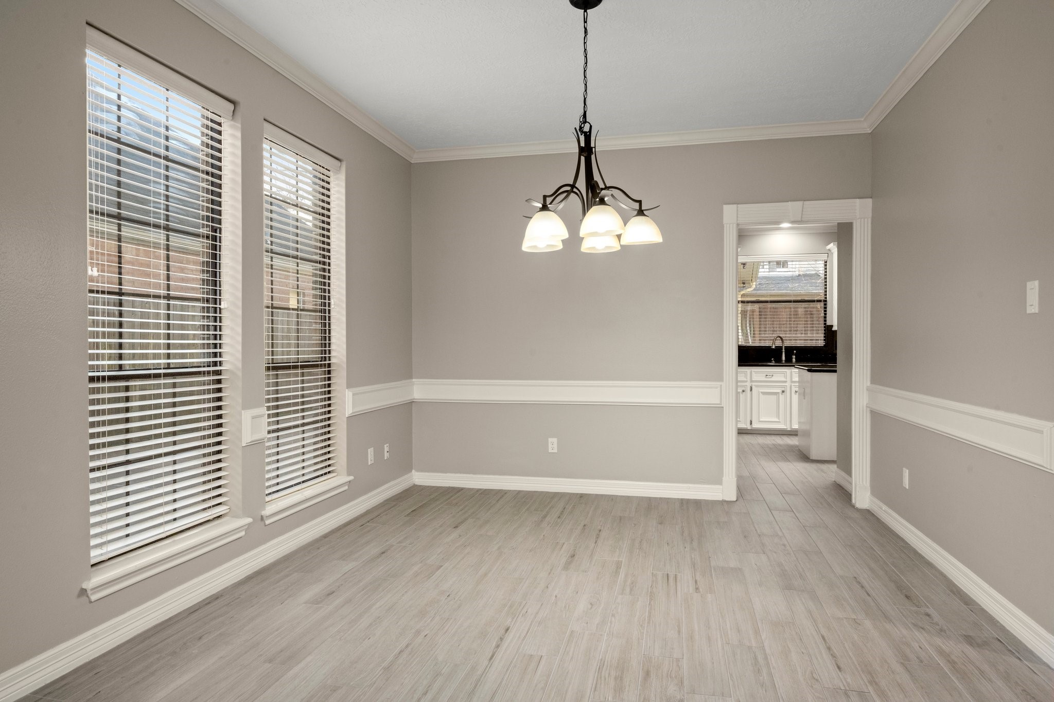 8222 Redchurch Drive Spring, TX 77379 - Photo 8 of 36 a view of empty room with wooden floor and fan