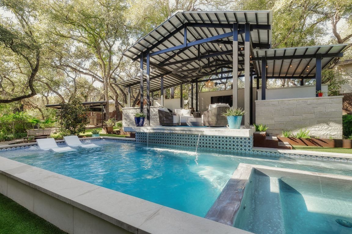a view of swimming pool with outdoor seating