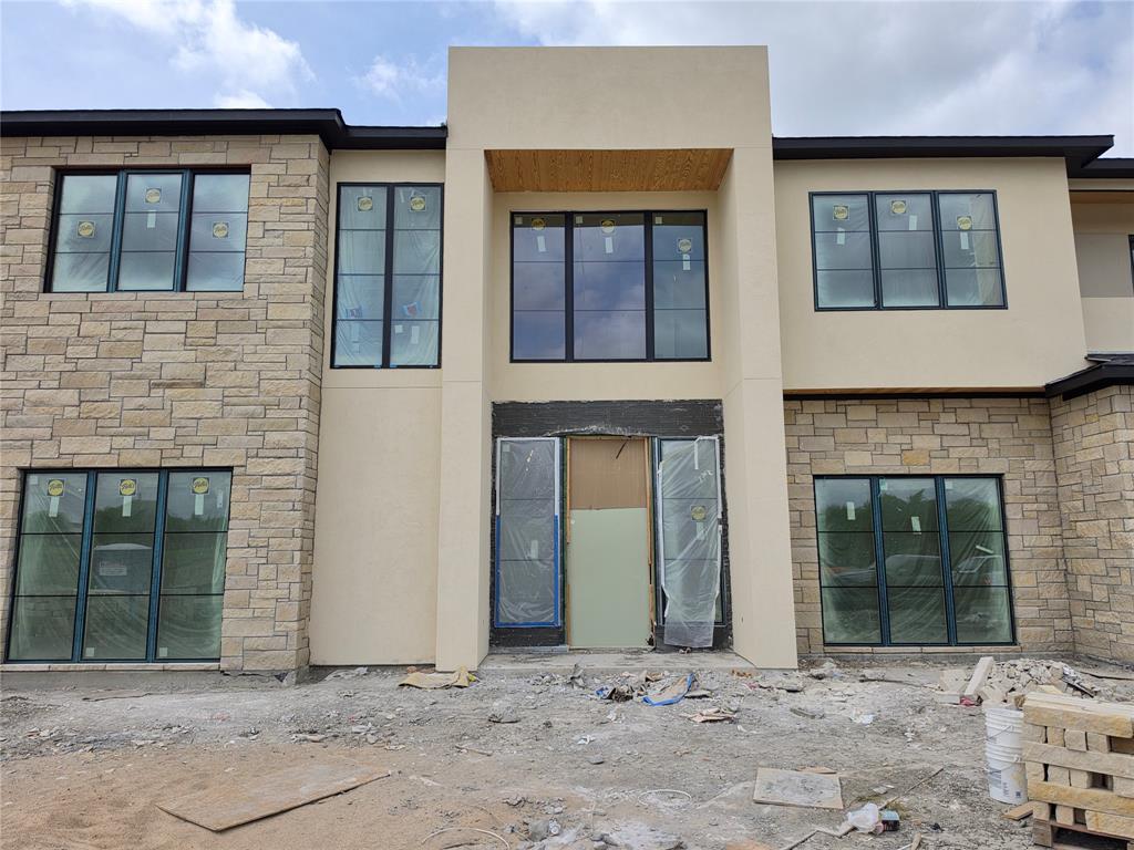 110 Timber Cv Place Heath, TX 75032 - Photo 3 of 15 a front view of a house with a yard
