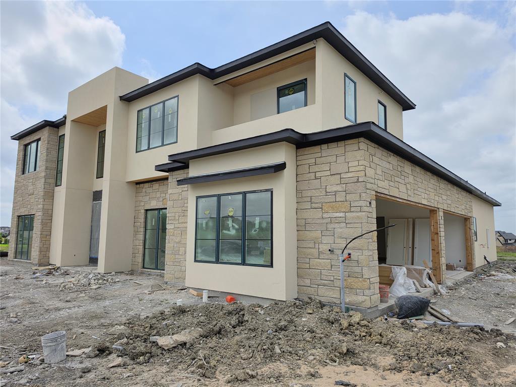 110 Timber Cv Place Heath, TX 75032 - Photo 4 of 15 a view of a house with a backyard