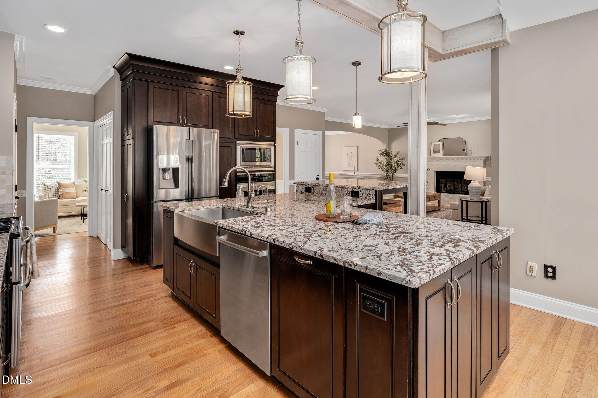 8325 Stryker Court Raleigh, NC 27615 - Photo 13 of 53 a kitchen with stainless steel appliances granite countertop a kitchen island a stove and a sink