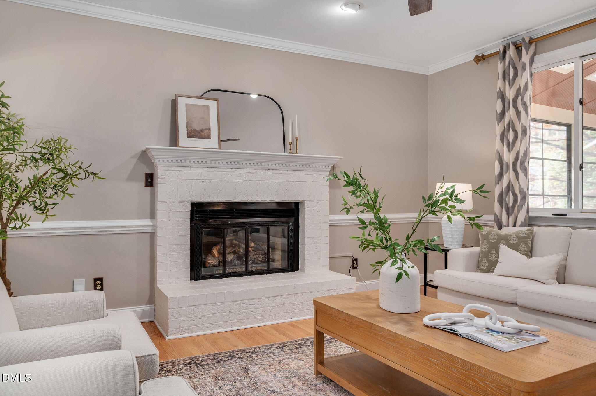 8325 Stryker Court Raleigh, NC 27615 - Photo 16 of 53 a living room with furniture and a fireplace