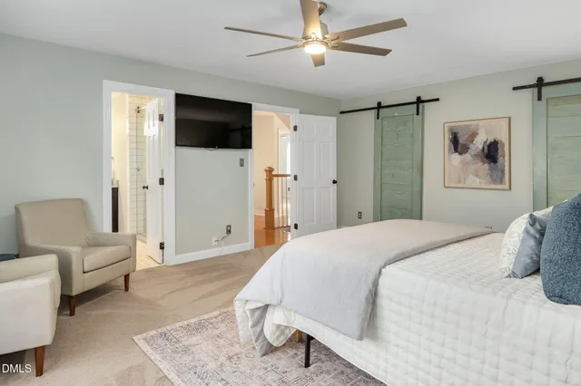 a bathroom with a granite countertop double vanity sinks and a mirror