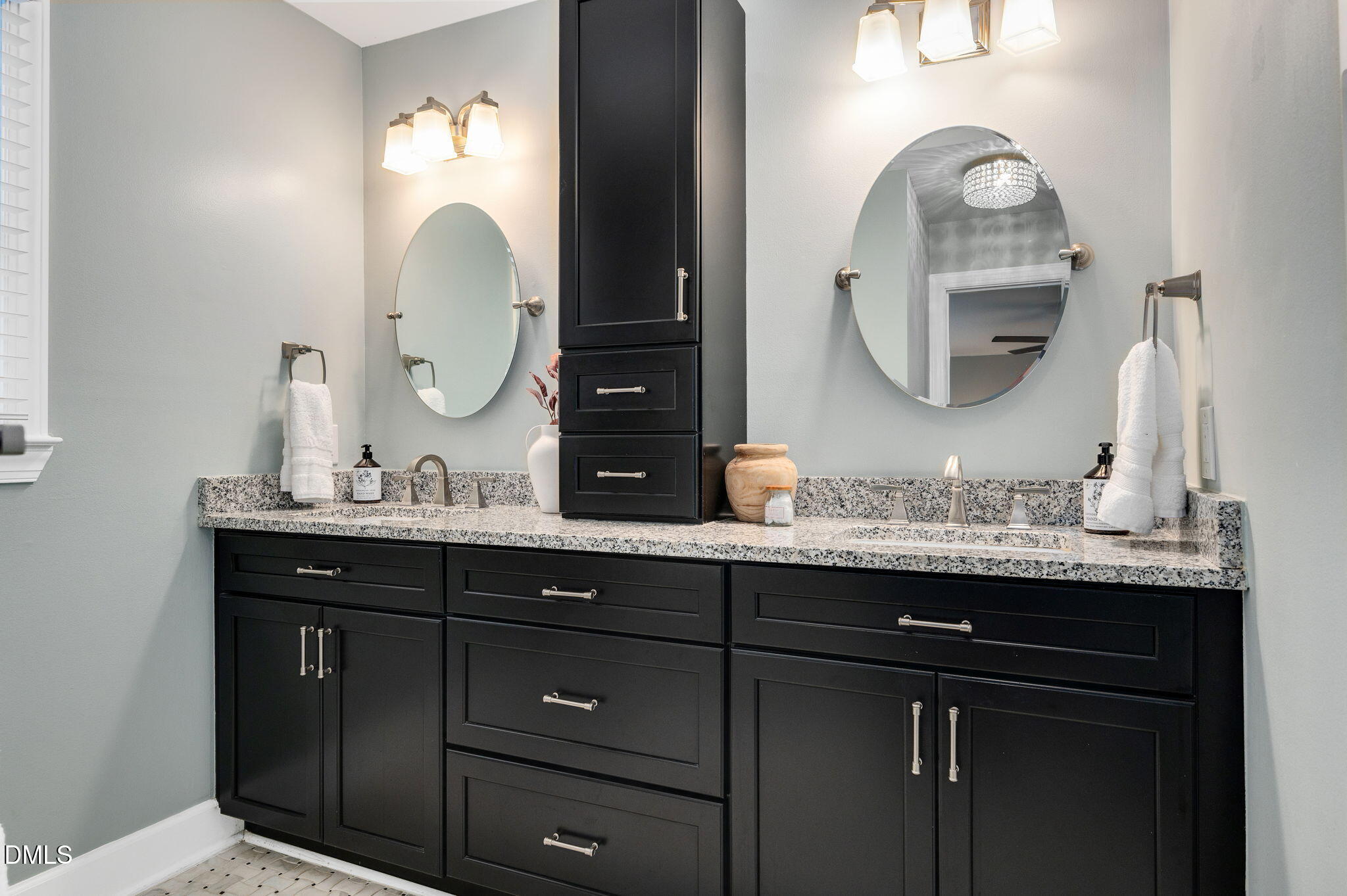 8325 Stryker Court Raleigh, NC 27615 - Photo 25 of 53 a bathroom with a granite countertop double vanity sinks and a mirror