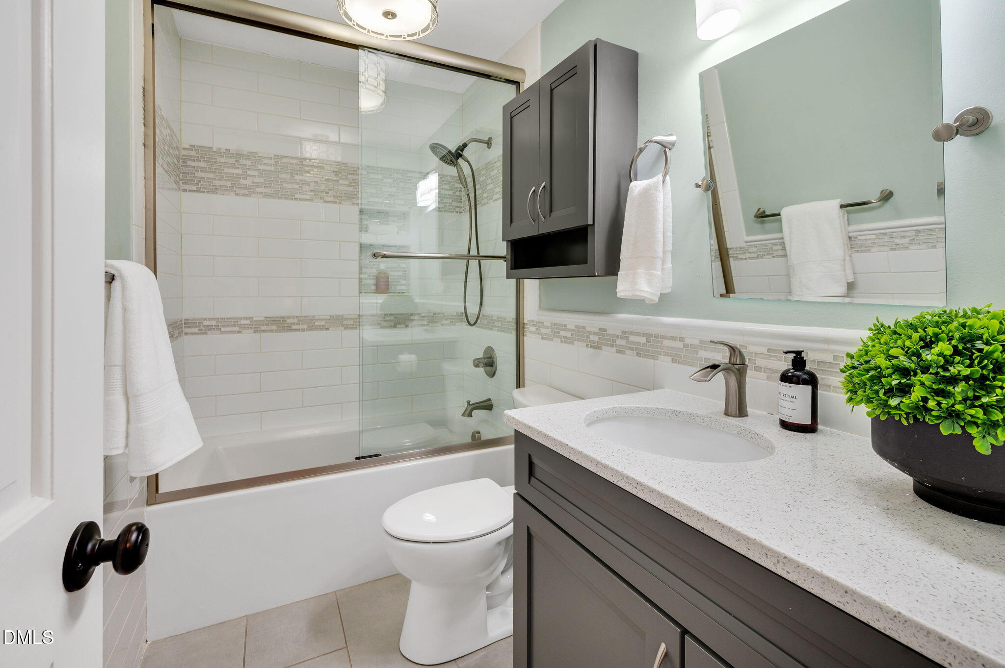 8325 Stryker Court Raleigh, NC 27615 - Photo 29 of 53 a bathroom with a sink a toilet and shower