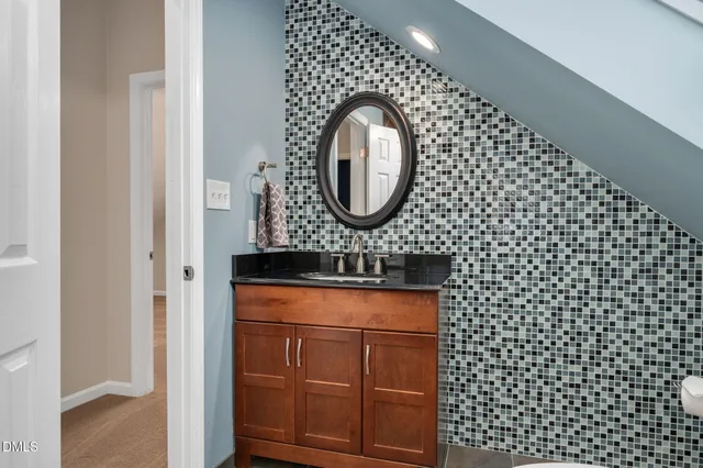 a bathroom with a glass shower door