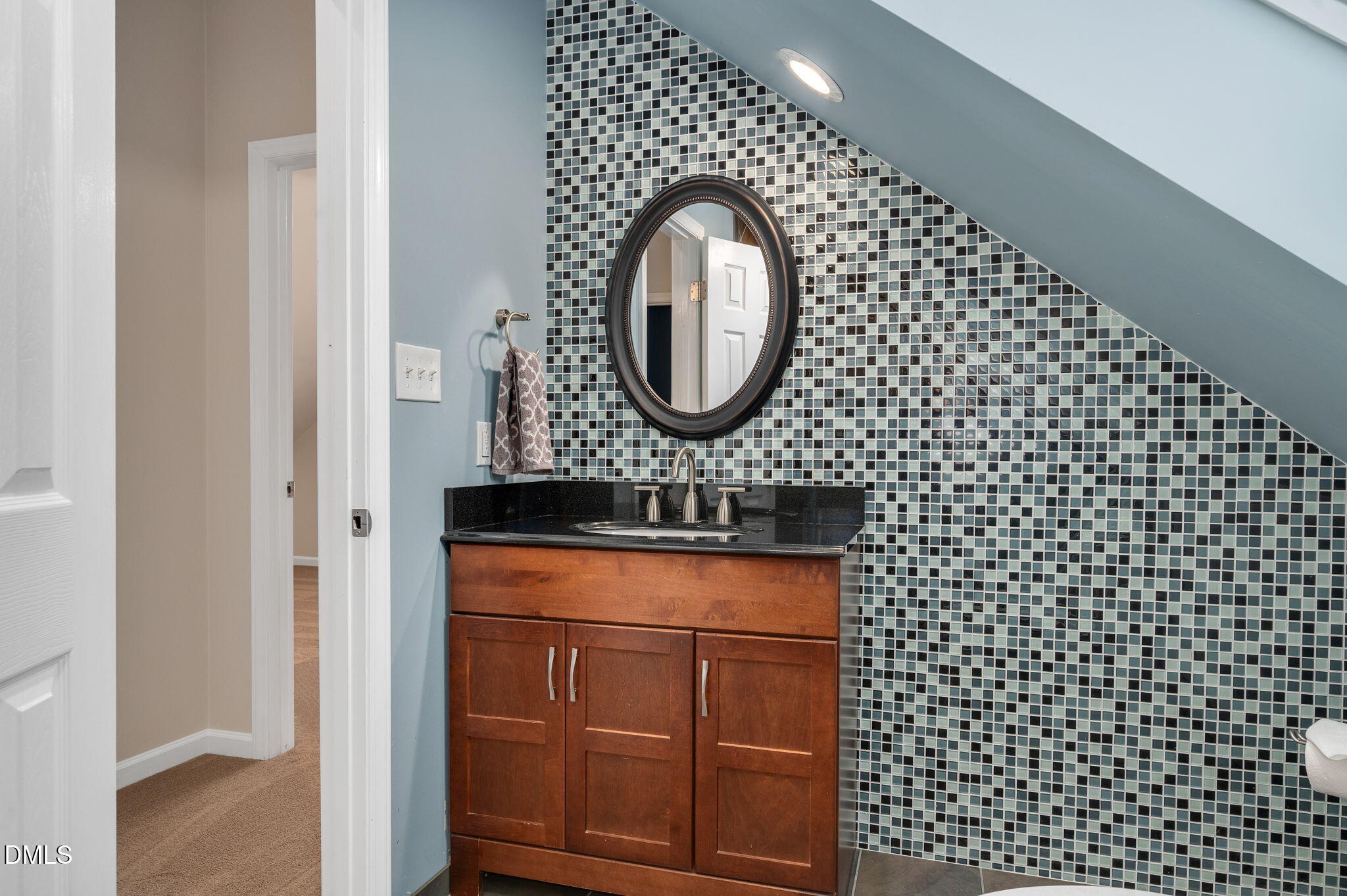 8325 Stryker Court Raleigh, NC 27615 - Photo 37 of 53 a bathroom with a sink a toilet and a shower