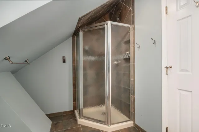 an empty room with fan and windows