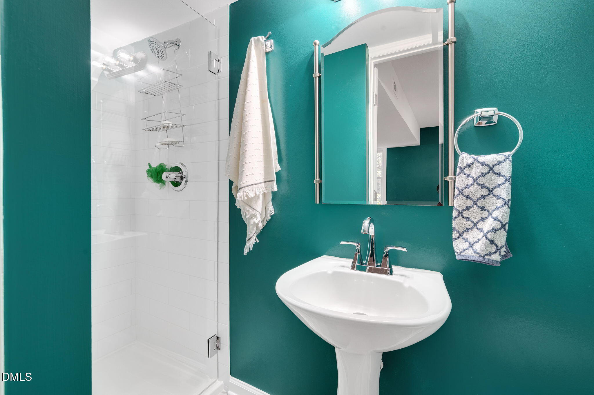 8325 Stryker Court Raleigh, NC 27615 - Photo 44 of 53 a bathroom with a sink and mirror