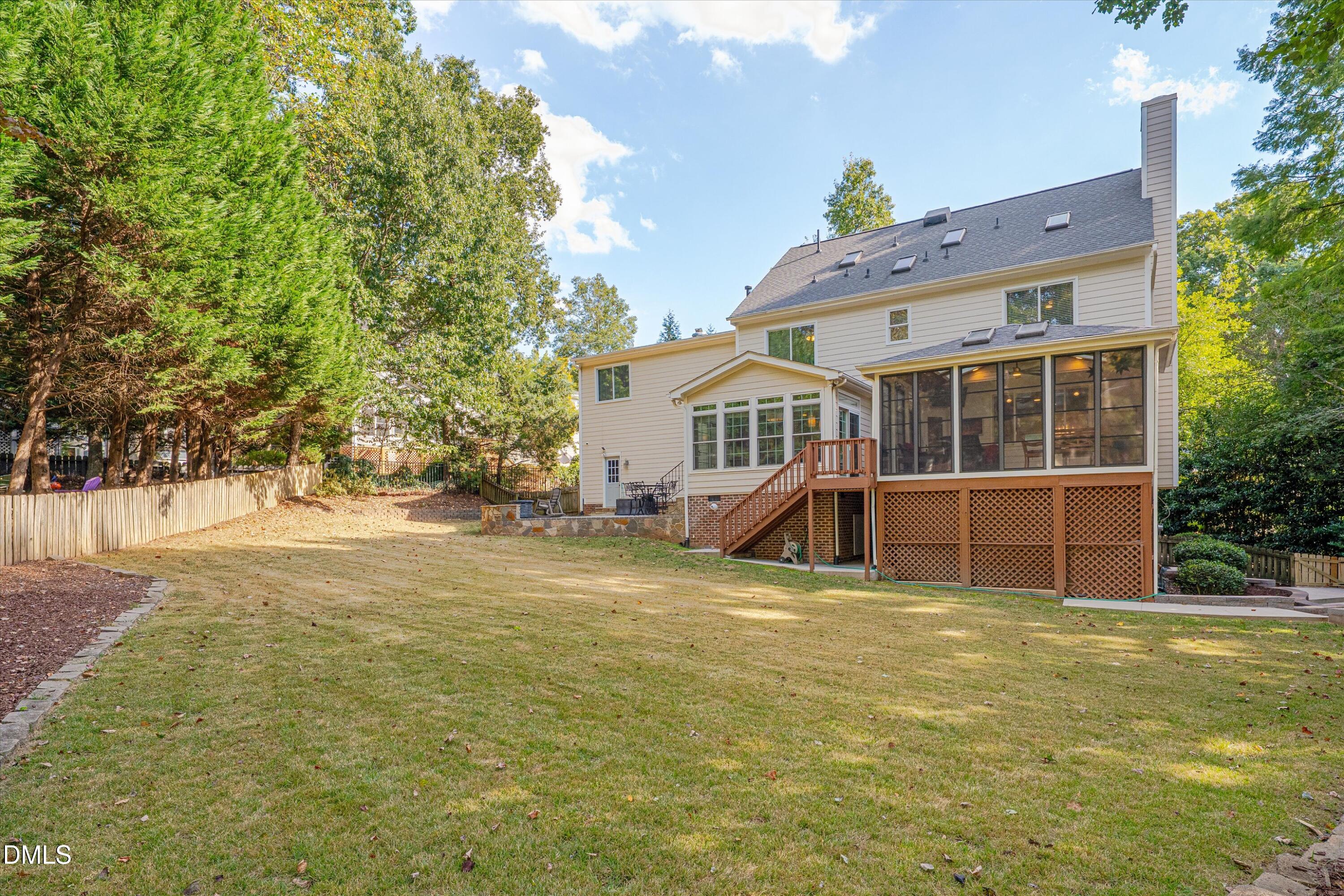 8325 Stryker Court Raleigh, NC 27615 - Photo 50 of 53 a view of a house with a garden and deck