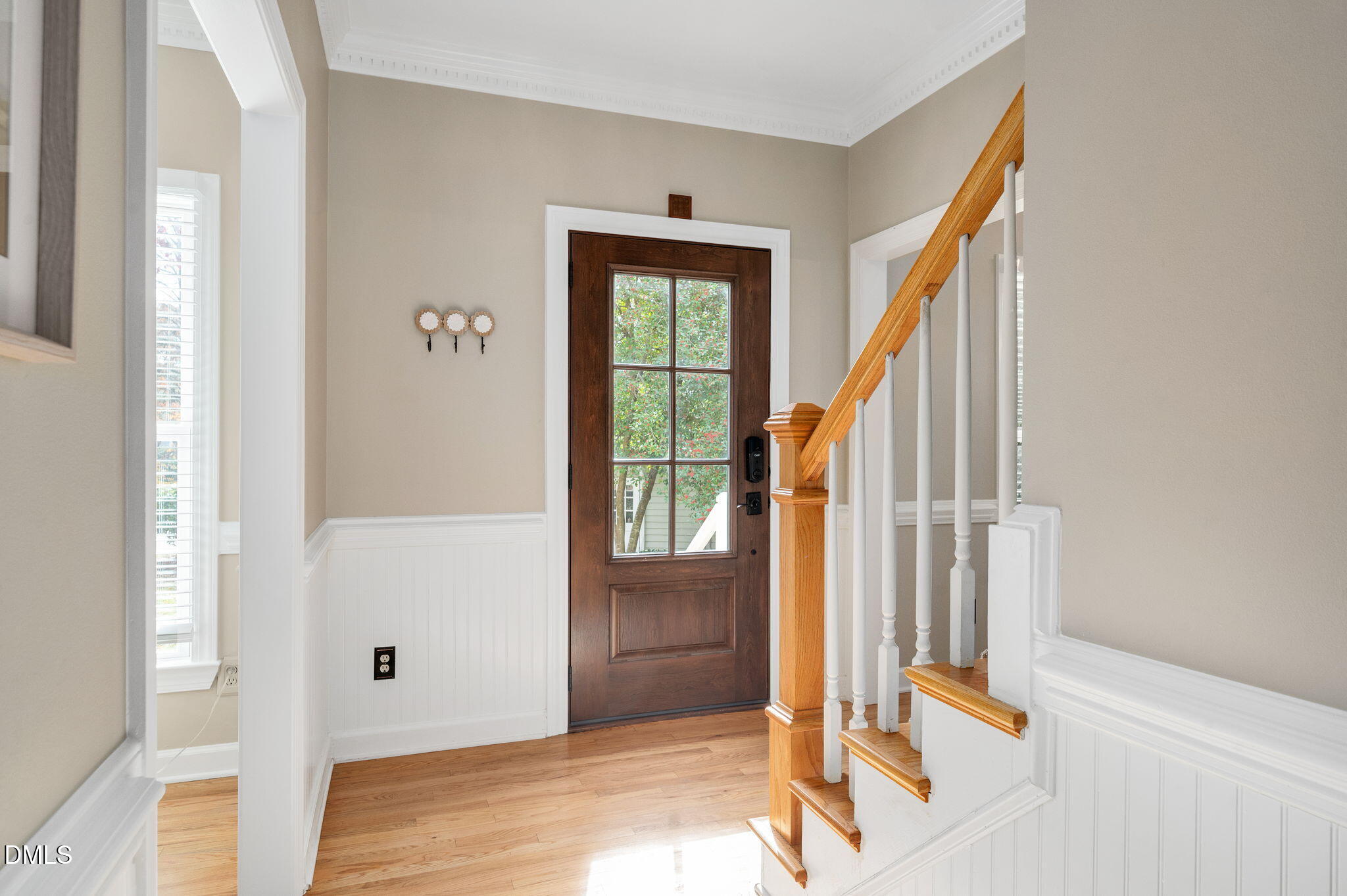 8325 Stryker Court Raleigh, NC 27615 - Photo 5 of 53 a view of entryway with wooden floor and door