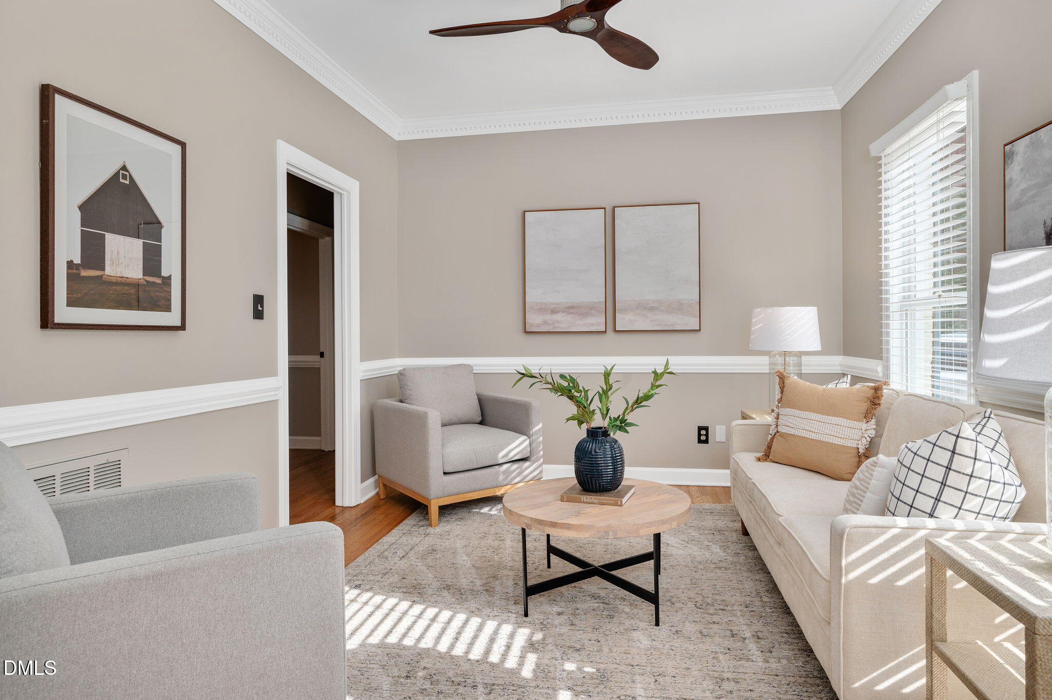 8325 Stryker Court Raleigh, NC 27615 - Photo 6 of 53 a living room with furniture and a potted plant