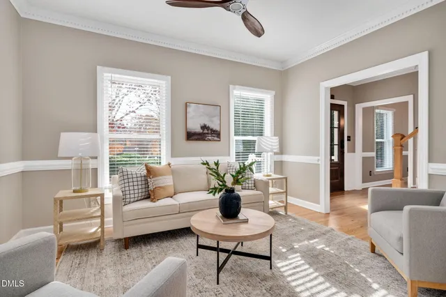 a view of a hallway with wooden floor and entryway
