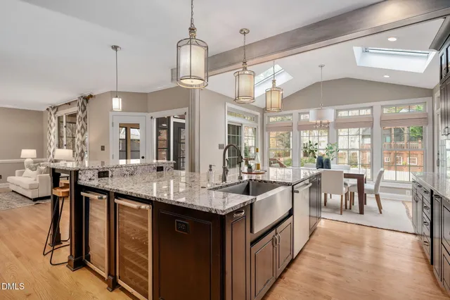 a large kitchen with lots of counter space and painting on the wall