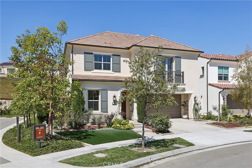 161 Sabbia Irvine, CA 92602 - Photo 2 of 11 a front view of a house with garden