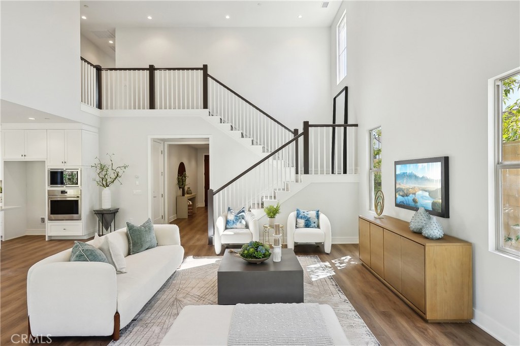 161 Sabbia Irvine, CA 92602 - Photo 3 of 11 a living room with furniture and wooden floor