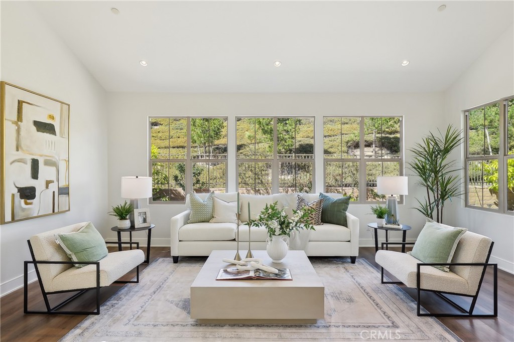 161 Sabbia Irvine, CA 92602 - Photo 4 of 11 a living room with furniture and a large window